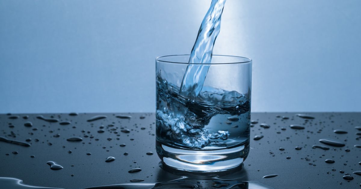 Fresh water pouring into a clear glass